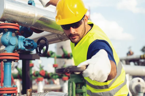 depositphotos_212242728-stock-photo-oil-worker-turning-valve-oil